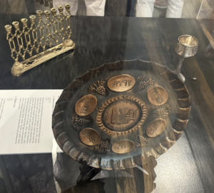 Hanukkiah, kiddish cup, and seder plate taken from Europe to Shanghai by refugees from the Nazis. (Photo: Cailin Acosta)